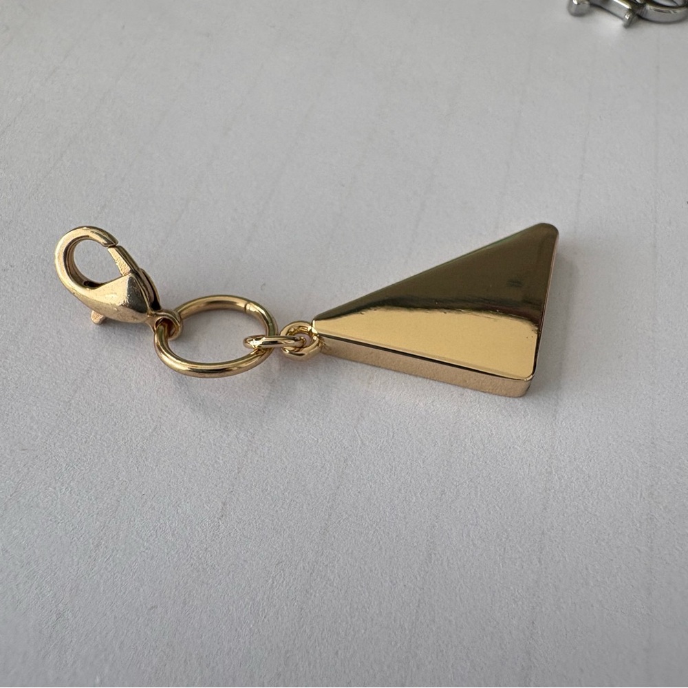 Prada Gold Triangle Logo Charm with Cream Enamel - Picture 7 of 9